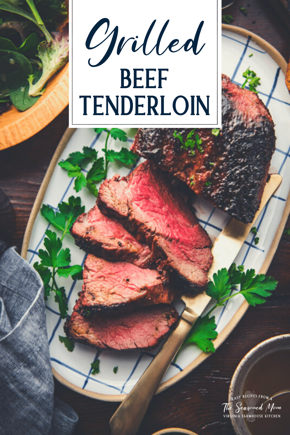 Platter of grilled beef tenderloin with text title overlay