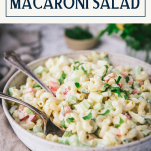 Close up side shot of the best macaroni salad recipe with a text title box at top