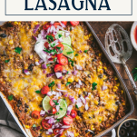 Overhead shot of a pan of mexican lasagna with text title box at top
