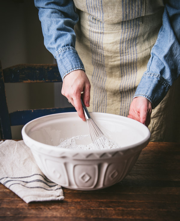 Whisking together dry ingredients in a large bowl