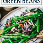 Close up side shot of the best roasted green beans recipe with text title box at top