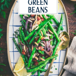 Overhead shot of a tray of roasted green beans with text title overlay