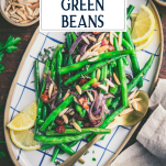 Overhead shot of a tray of the best roasted green beans recipe with text title overlay