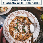 Bowl of pulled pork with alabama white bbq sauce and text title box at top