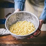 Boiled elbow macaroni noodles in a colander