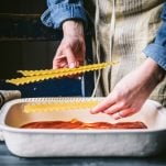 Process shot showing how to make spinach lasagna