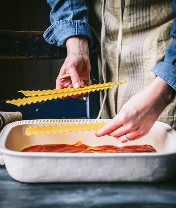 Process shot showing how to make spinach lasagna