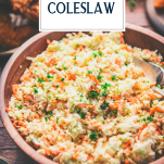 Close up side shot of a bowl of traditional coleslaw with text title overlay