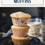 Stack of blackberry muffins with text title box at top