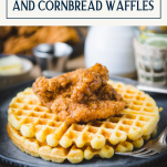 Side shot of a plate of homemade chicken and waffles recipe with text title box at top