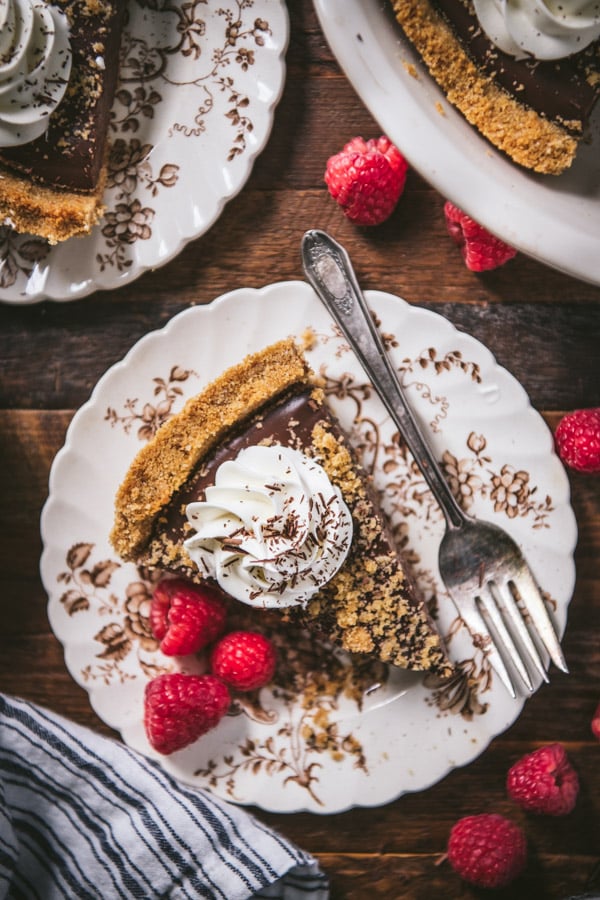 Overhead shot of a slice of chocolate pudding pie on a vintage plate