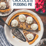 Overhead shot of a chocolate pudding pie on a wooden table with text title overlay