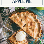 Overhead shot of a sliced apple pie with text title box at top