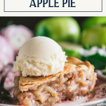 Close up side shot of a slice of apple pie on a plate with text title box at top