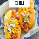 Overhead shot of a basket of chili dogs with text title overlay