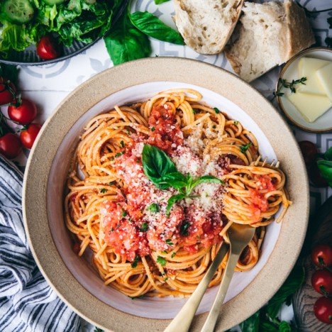 Overhead image of a pasta bowl full of spaghetti with fresh homemade Italian pomodoro sauce