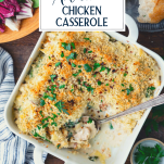 Overhead shot of a spoon in a dish of spinach artichoke chicken casserole with text title overlay