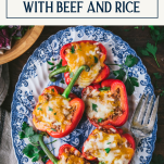 Blue and white plate of stuffed bell peppers with text title box at top