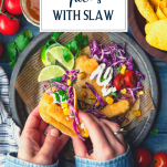 Overhead shot of hands eating easy fish tacos from a plate with text title overlay