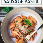 Close up shot of a bowl of creamy pasta sausage with text title box at top