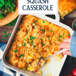 Overhead image of hands serving southern squash casserole with a spoon and text title overlay
