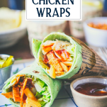 Close up front shot of bbq chicken wraps with avocado and bacon on a plate with text title overlay