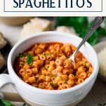 Side shot of a bowl of spaghettios with text title box at top