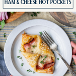 Hands holding a plate of homemade ham and cheese croissant with text title box at top