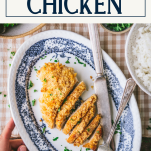 Holding a plate of sour cream chicken with text title box at top