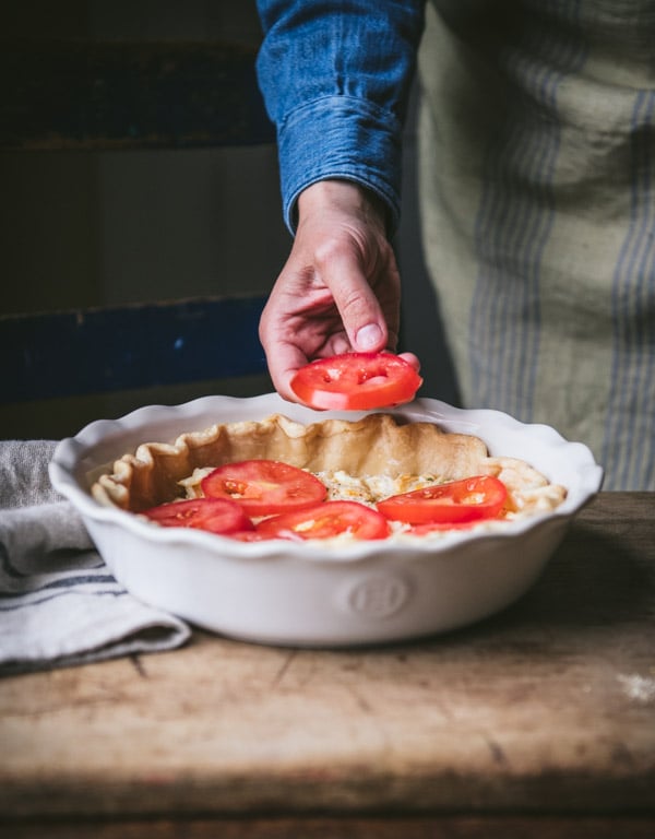 Layering tomato slices in a pie crust