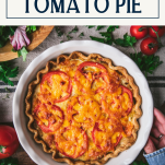 Overhead shot of hands holding a southern tomato pie recipe with text title box at top