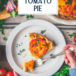 Overhead shot of hands eating a slice of tomato pie with text title overlay