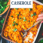 Serving spoon in a dish of dorito casserole with text title overlay
