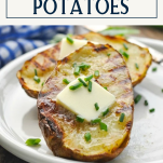 Front shot of grilled baked potatoes with text title box at top