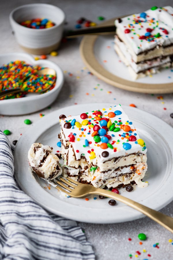 Two plates of ice cream sandwich cake on a white table