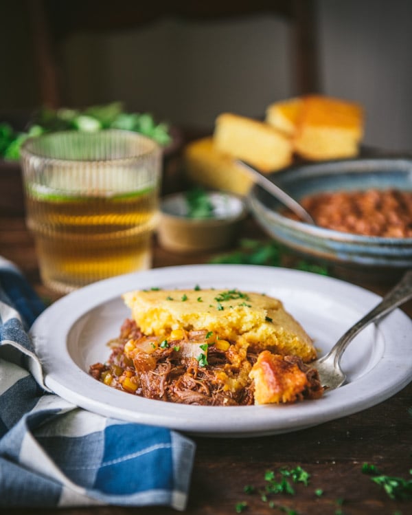 Side shot of pulled pork casserole with cornbread topping