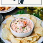 Platter of shrimp dip and potato chips with text title box at top
