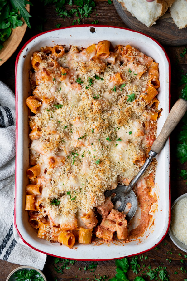 Close overhead image of a rigatoni bake with cheese and breadcrumbs on top