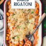 Overhead image of a spoon in a pan of vegetarian baked rigatoni with text title overlay