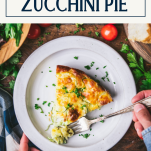 Hands eating a bite of zucchini pie from a slice on a plate with text title box at top