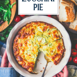 Hands holding a sliced zucchini pie with text title overlay
