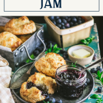 Blueberry jam and biscuits on a table with text title box at top
