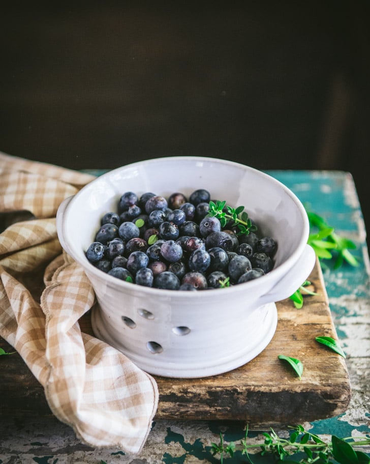 Fresh blueberries in a colander