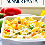 Side shot of a white dish of baked summer pasta with text title box at top