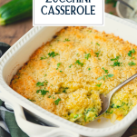 Spoon serving from a dish of zucchini casserole with text title overlay