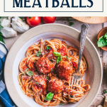 Overhead shot of a bowl of spaghetti and homemade meatballs with text title box at top