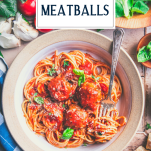 Overhead shot of a bowl of homemade meatballs with spaghetti and text title overlay