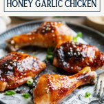 Side shot of sticky honey garlic chicken with text title box at top