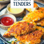 Close up side shot of a plate of baked chicken tenders with text title overlay
