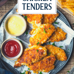 Overhead shot of a plate of baked chicken tenders with text title overlay